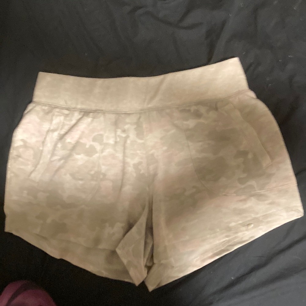 Cream colored camo print shorts